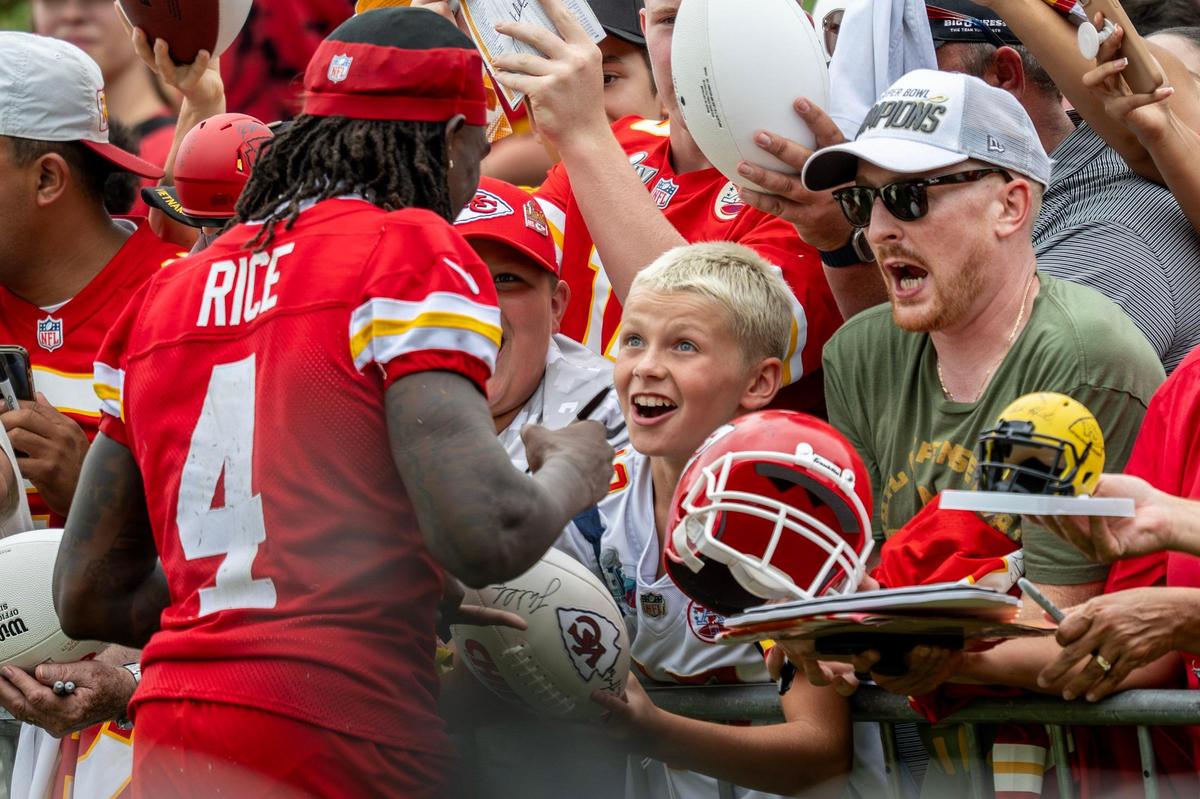 Kansas City Chiefs wide receiver Rashee Rice (4) signs autographs from fans after practice during training camp at Missouri Western State University on Thursday, July 24, 2025, in St. Joseph.