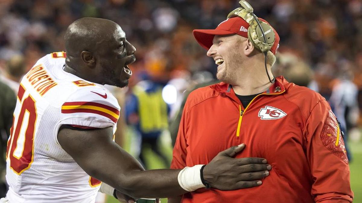 Chiefs outside linebacker Justin Houston (left) and new defensive line coach Britt Reid following a victory at Denver last year.