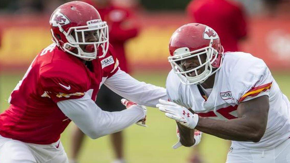 
Kansas City Chiefs tight end Demetrius Harris (left) tried to block Dee Ford on Wednesday morning during Kansas City Chiefs training camp at Missouri Western State University in St. Joseph, Mo.
