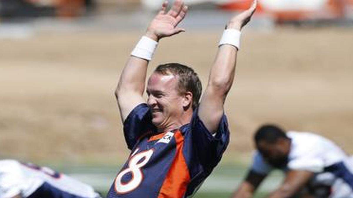 
Denver Broncos quarterback Peyton Manning was all smiles as he and his teammates prepared this summer to improve on their Super Bowl season of 2013.
