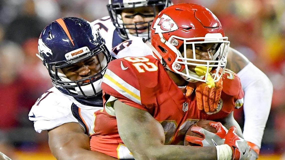 Kansas City Chiefs running back Spencer Ware was tackled by Denver Broncos inside linebacker Todd Davis on Sunday.