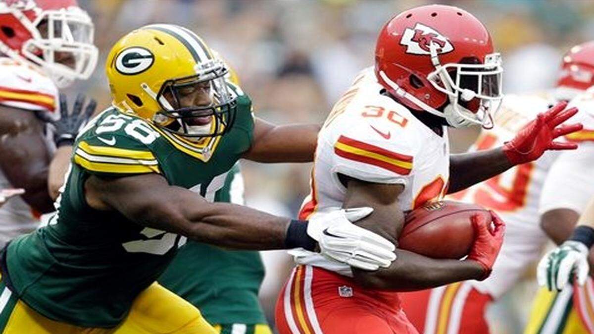 
The Packers' Sam Barrington stops the Chiefs' Joe McKnight on special teams during the first half of Thursday’s preseason game in Green Bay, Wis.
