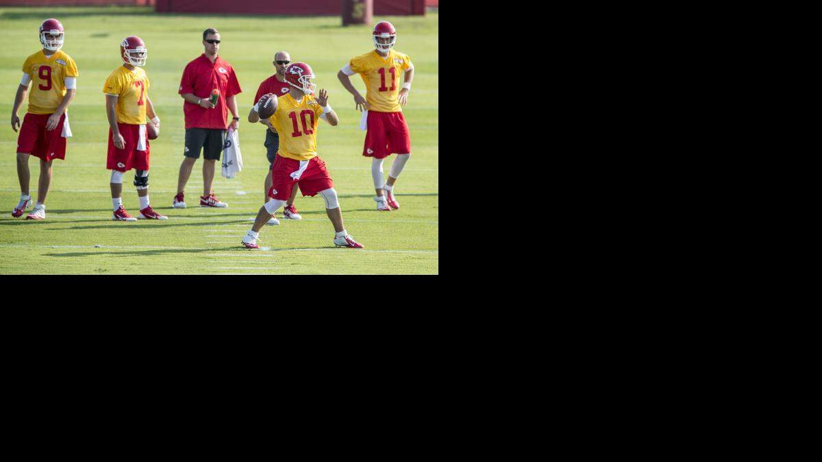 
Kansas City Chiefs backup quarterback Chase Daniel (foreground) threw a pass at training camp as the team’s quarterbacks worked out at Missouri Western in St. Joseph.
