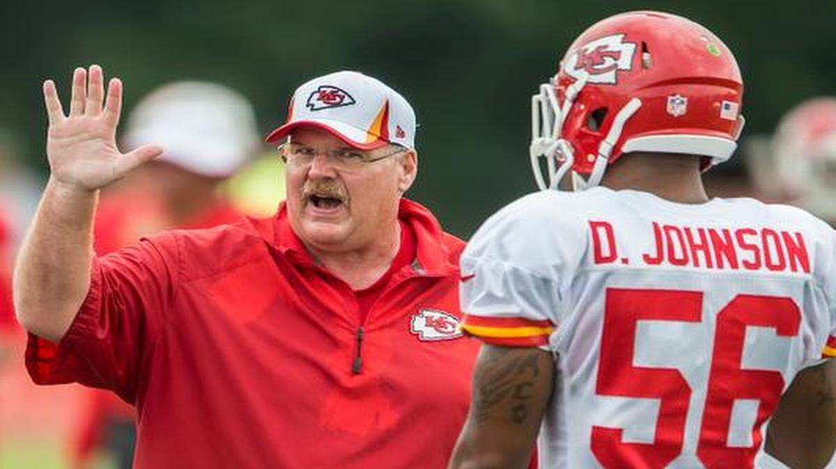 
Chiefs coach Andy Reid talks with linebacker Derrick Johnson (56) summer training camp practice at Missouri Western State University in St. Joseph.
