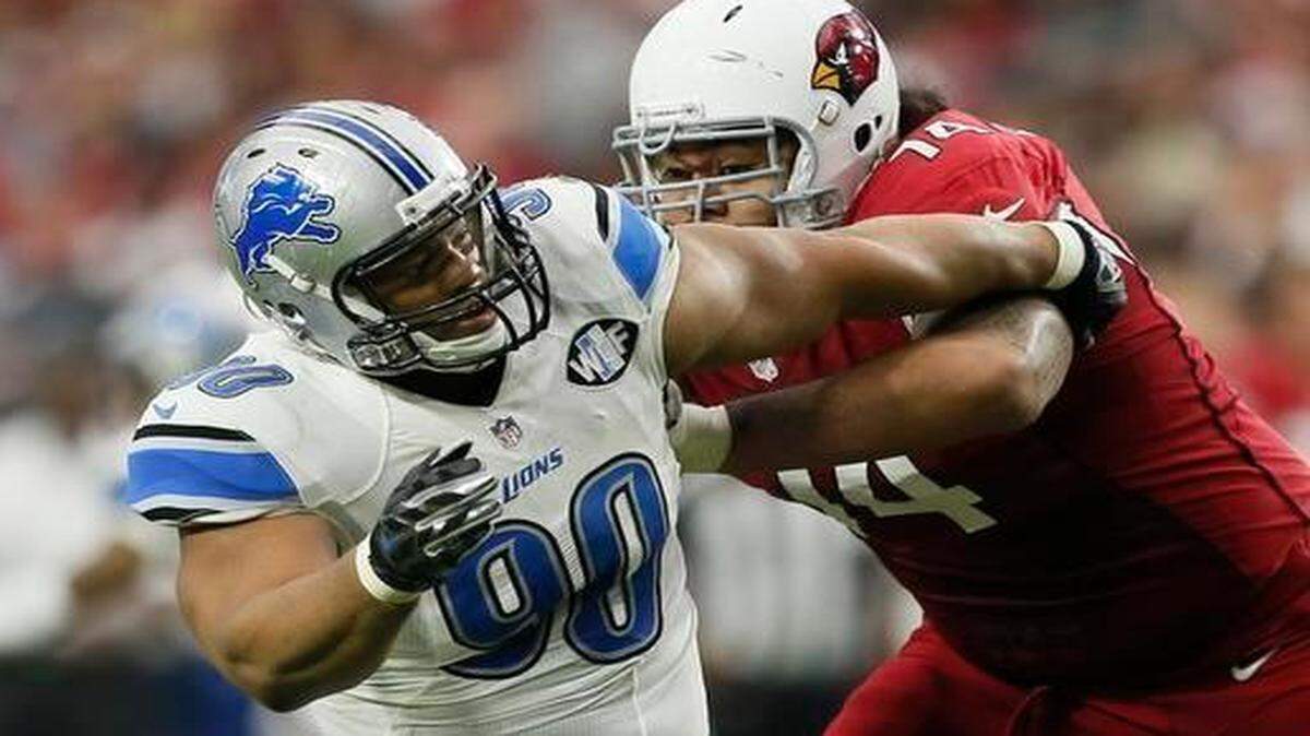 
Paul Fanaika (right) started 30 of 32 regular-season games at right guard for the Cardinals the last two years, including this one against Detroit and Ndamukong Suh last season.
