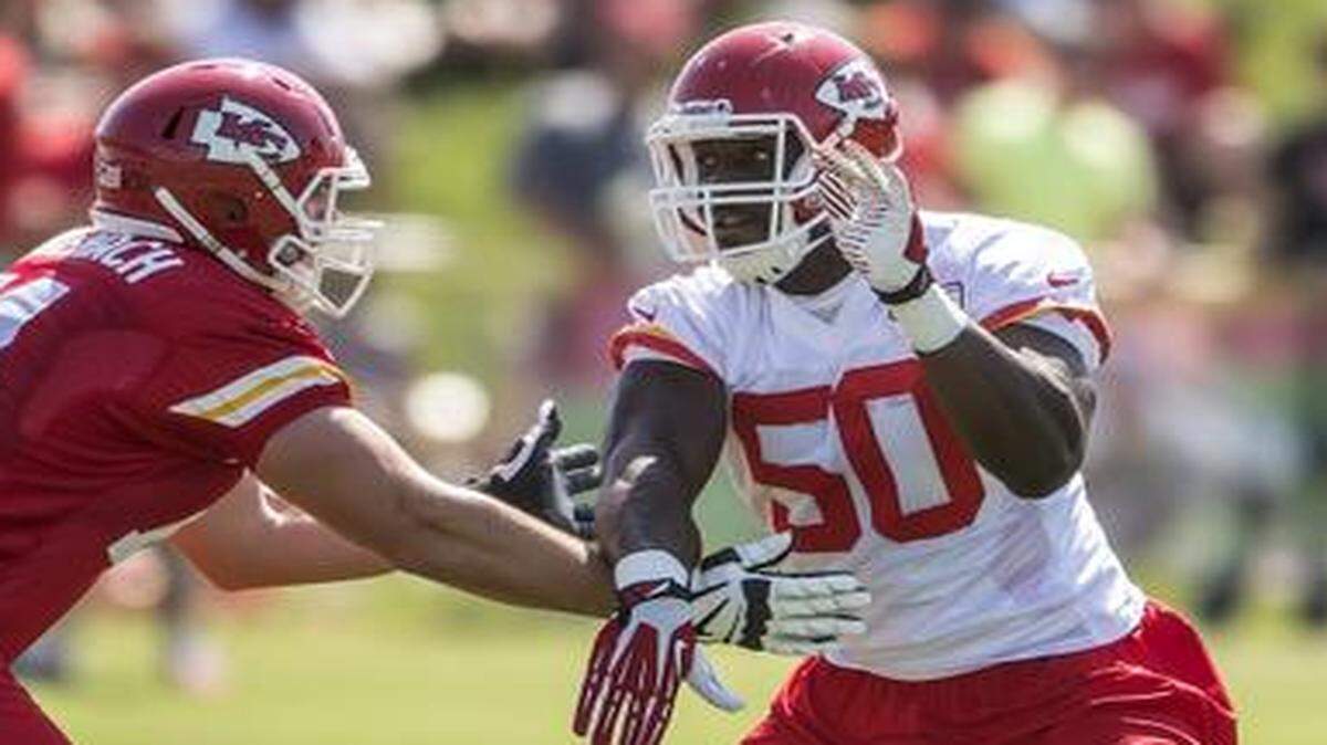 
Chiefs linebacker Justin Houston (50) rushed around the block of guard Jeffrey Linkenbach (74) during practice on Thursday afternoon during Kansas City Chiefs summer training camp at Missouri Western State University in St. Joseph.
