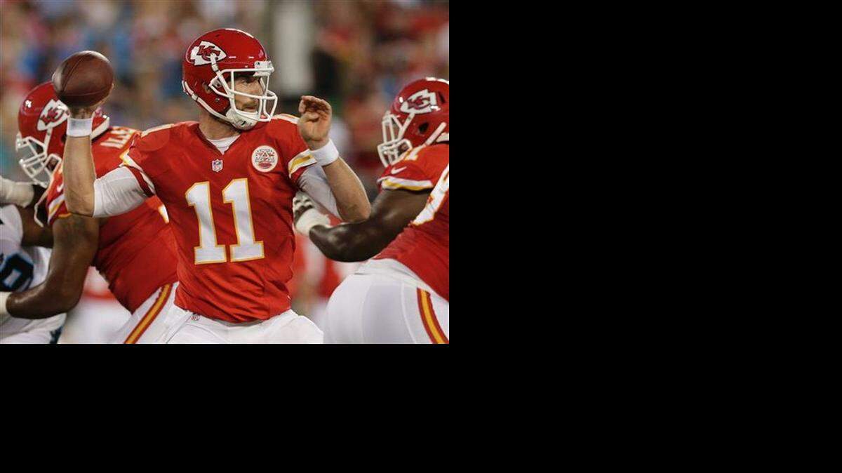 
Kansas City Chiefs' Alex Smith (11) looks to pass against the Carolina Panthers during the first half of a preseason NFL football game in Charlotte, N.C., Sunday, Aug. 17, 2014. 
