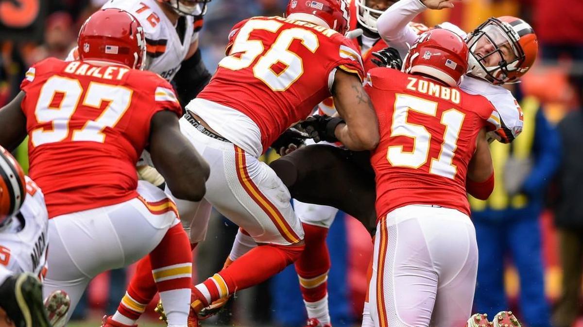 Cleveland Browns quarterback Johnny Manziel (2) was hit after his second-quarter pass by Kansas City Chiefs inside linebacker Derrick Johnson (56) and outside linebacker Frank Zombo (51) on Sunday. The Chiefs won 17-13 and clinched a spot in the playoffs.