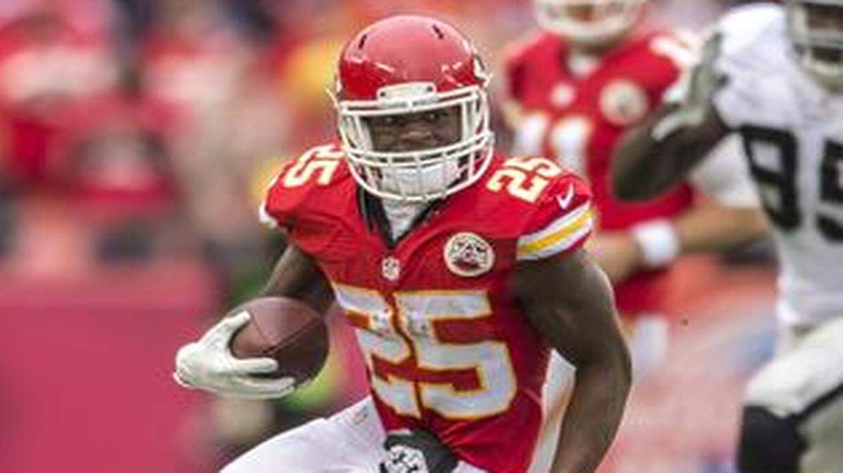
Kansas City Chiefs running back Jamaal Charles was tackled by Oakland Raiders strong safety Brandian Ross (29) in the second quarter on Sunday at Arrowhead Stadium in Kansas City, Mo. The Chiefs won 31-13.
