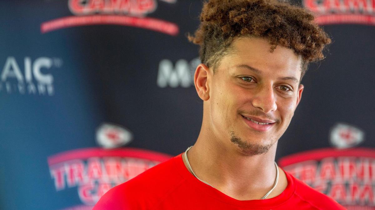 Kansas City Chiefs quarterback Patrick Mahomes (15) answers questions from the media after the last day of practice at Chiefs training camp on Thursday, Aug. 18, 2022, in St. Joseph.