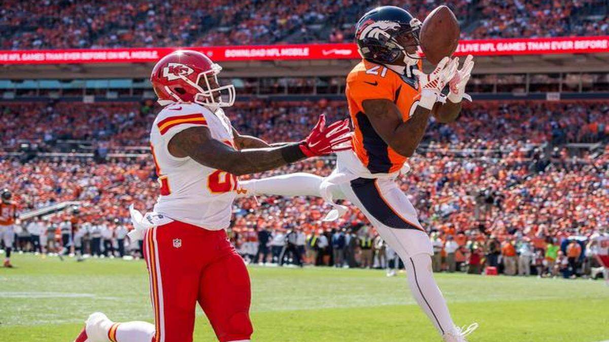
Broncos cornerback Aqib Talib (21) bobbled an interception and dropped the football in the end zone behind intended receiver Dwayne Bowe of the Chiefs in NFL action on Sunday in Denver.
