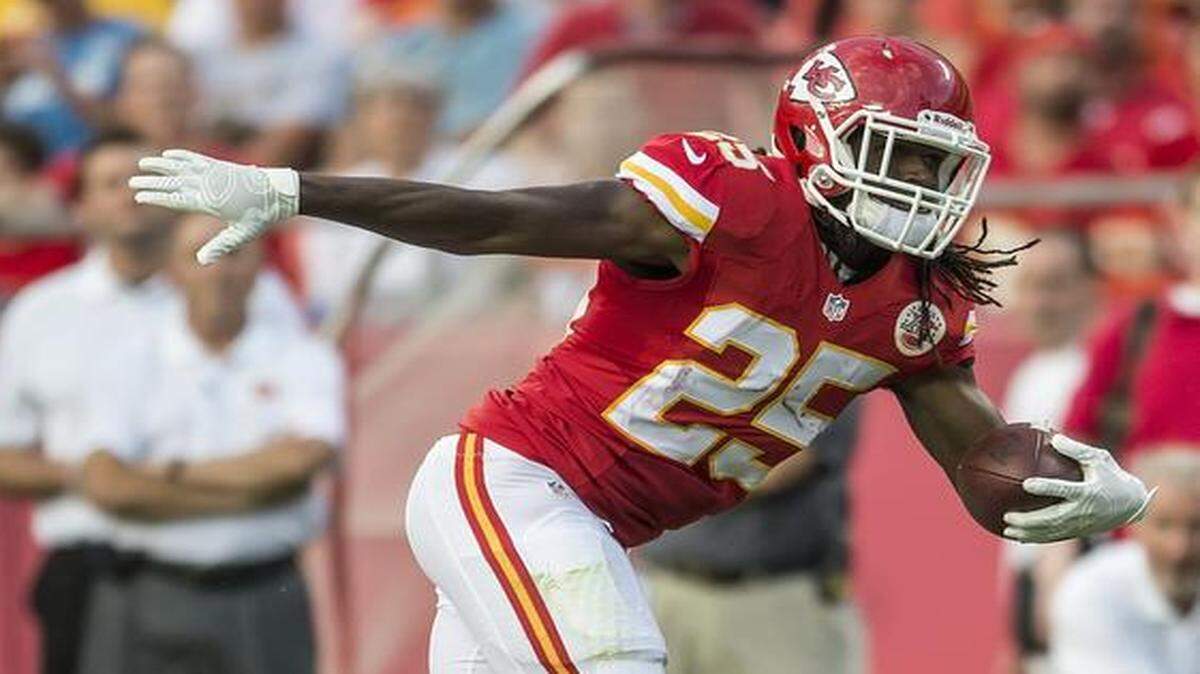
Kansas City Chiefs running back Jamaal Charles (25) was tackled in the first quarter by Cincinnati Bengals free safety Reggie Nelson in the opening week of the 2014 NFL preseason on August 7, 2014, at Arrowhead Stadium in Kansas City, Mo.
