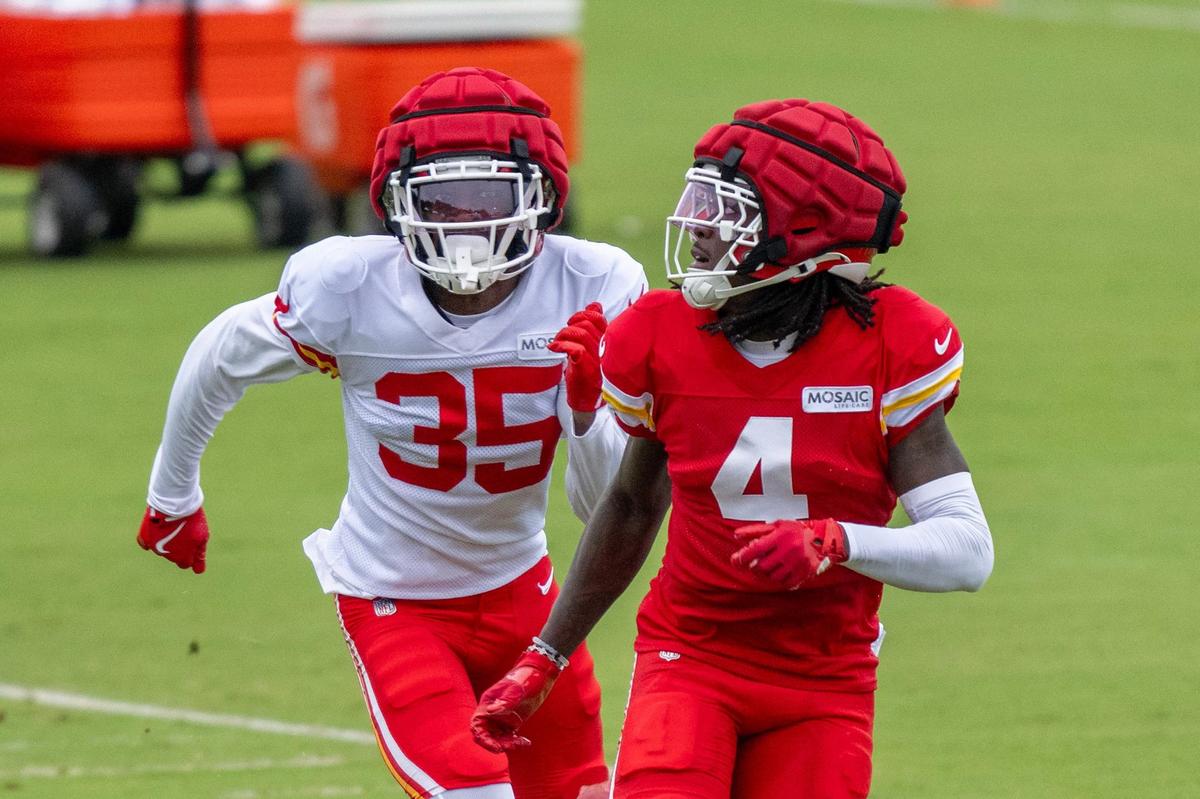 Kansas City Chiefs cornerback Jaylen Watson (35) runs a drill with wide receiver Rashee Rice (4) during practice at training camp on Tuesday, Aug. 13, 2024, in St. Joesph.