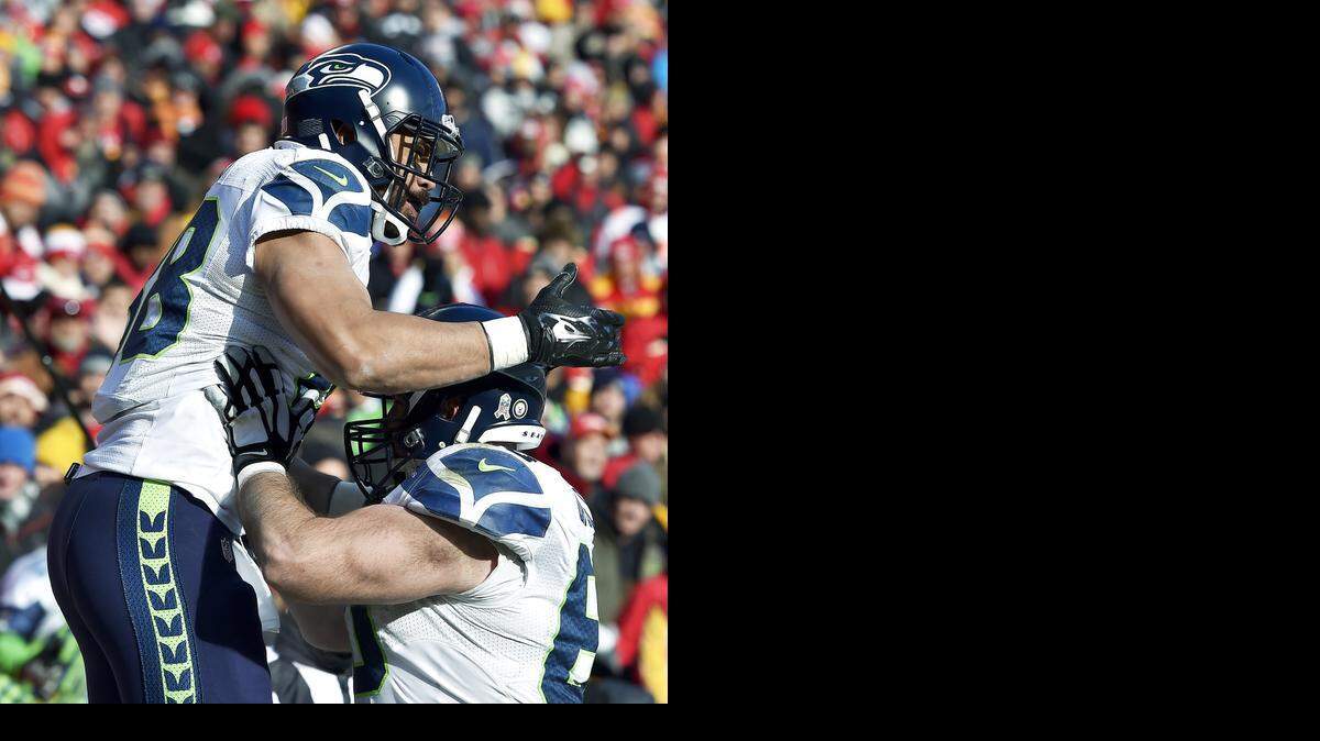 
Seattle Seahawks tight end Tony Moeaki (left) celebrates his third-quarter touchdown with center Max Unger on Sunday at Arrowhead Stadium. Moeaki is a former third-round draft pick by the Chiefs.
