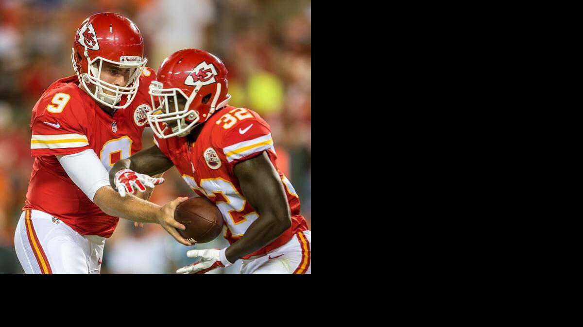 
Kansas City Chiefs quarterback Tyler Bray (9) handed the ball off to Kansas City Chiefs running back Cyrus Gray (32) against the Cincinnati Bengals in the opening week of the 2014 NFL preseason on August 7, 2014 at Arrowhead Stadium in Kansas City, Mo.
