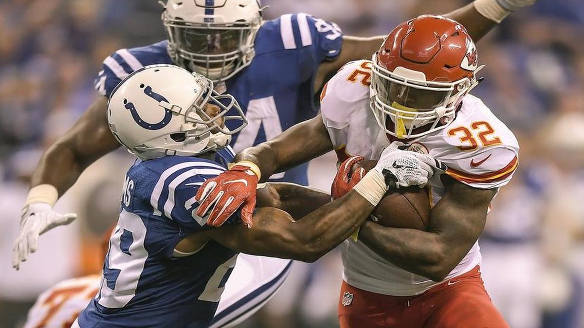 Kansas City Chiefs running back Spencer Ware (32) fought off Indianapolis Colts strong safety Mike Adams (29) in the second quarter on October 30, 2016 at Lucas Oil Stadium in Indianapolis.