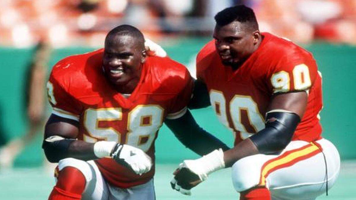 Derrick Thomas (left) called Neil Smith his “partner in crime.” They attacked passers from different directions and combined for 213 career sacks with the Chiefs.