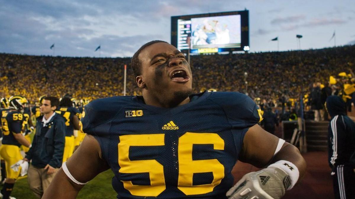 Michigan defensive tackle Ondre Pipkins (56) pumps up the crowd from the sidelines in the fourth quarter Oct. 20, 2012, in Ann Arbor, Mich. Michigan beat Michigan State 12-10.