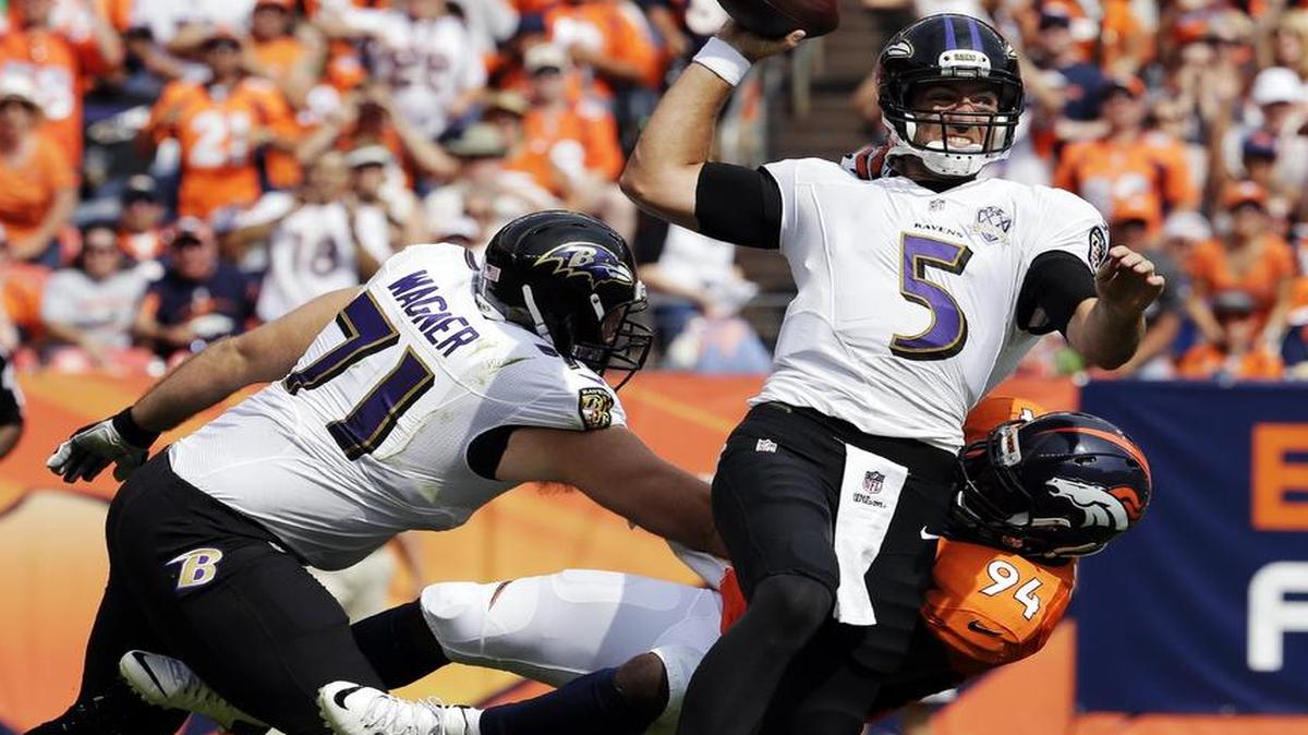 
Baltimore Ravens quarterback Joe Flacco was sacked by Broncos linebacker DeMarcus Ware, one of two Denver sacks on Sunday.
