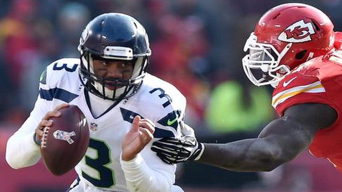 
Despite the fact that the Chiefs spent the entire game Sunday actively working to keep the 5-foot-11, 206-pound third-year pro in the pocket, Seattle Seahawks quarterback Russell Wilson still managed to complete 20 of 32 passes for 178 yards, two touchdowns and zero interceptions and rush eight times for 71 yards.
