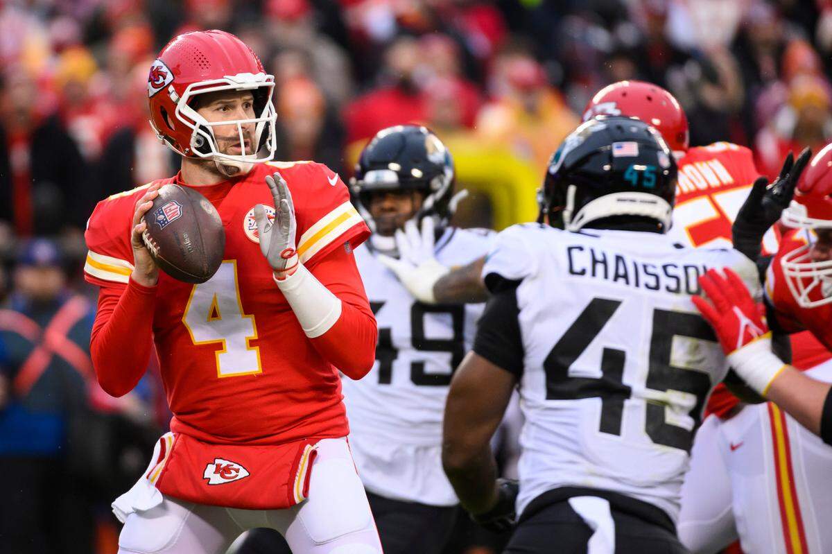 Kansas City Chiefs quarterback Chad Henne (4) looks to throw against the Jacksonville Jaguars during the first half of an NFL divisional round playoff football game, Saturday, Jan. 21, 2023 in Kansas City, Mo.
