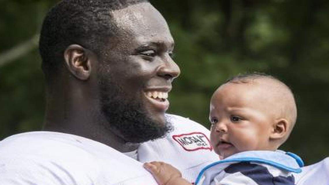 
Kansas City Chiefs defensive tackle Jaye Howard held one of his twin sons, Jeremiah, following a training camp practice at Missouri Western State University in St. Joseph, Mo. 
