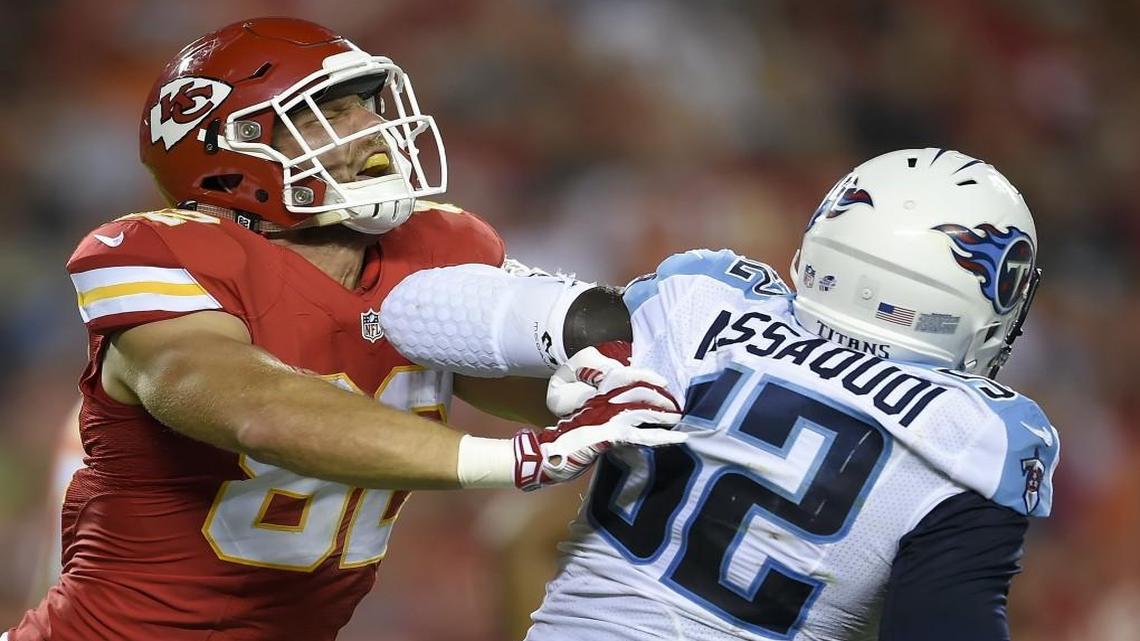 Jonathan Massaquoi (right), who got in a shoving match with the Chiefs’ Ryan Taylor in August, was signed by Kansas City on Wednesday. Last year, he was claimed off waivers by the Titans and was waived shortly before the regular-season opener