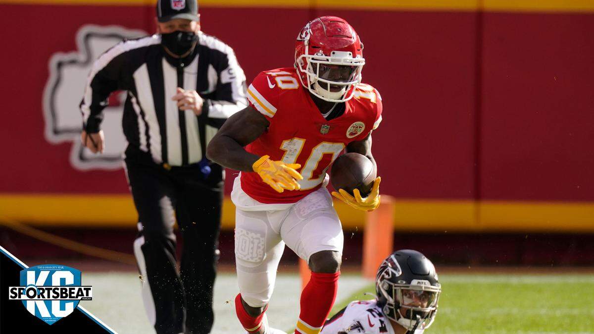 Kansas City Chiefs wide receiver Tyreek Hill runs down the sideline after evading a tackle by Atlanta Falcons A.J. Terrell during an NFL football game, Sunday, Dec. 27, 2020, in Kansas City. (AP Photo/Charlie Riedel)