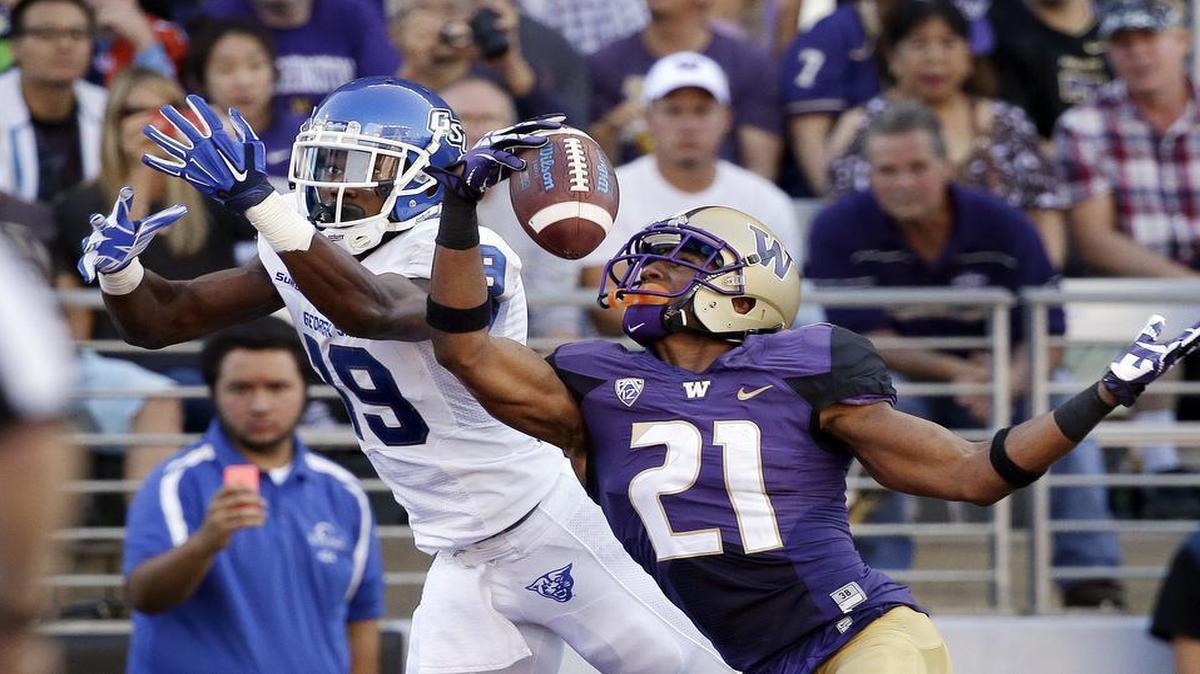 
Washington’s Marcus Peters picked off a pass front of Georgia State’s Robert Davis during a Sept. 20, 2014, game in Seattle. He was flagged for pass interference, however.
