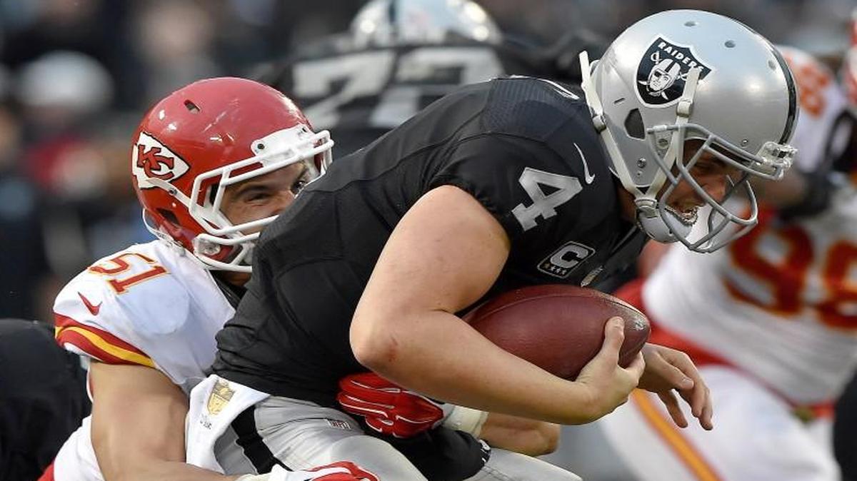 Chiefs linebacker Frank Zombo (51) sacked Raiders quarterback Derek Carr late in their game Sunday in Oakland.