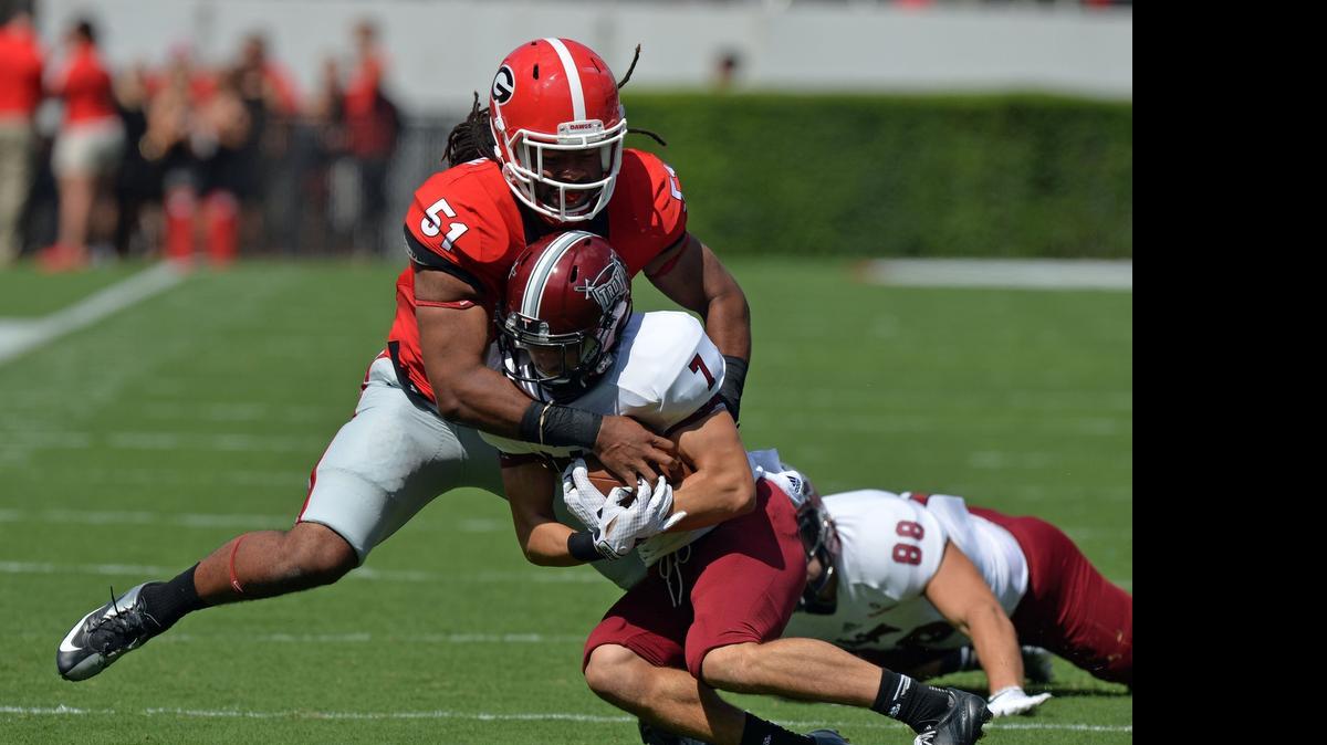 
 Georgia linebacker Ramik Wilson, tackling Troy wide receiver Teddy Ruben, is one of two inside linebackers the Chiefs drafted Saturday.
