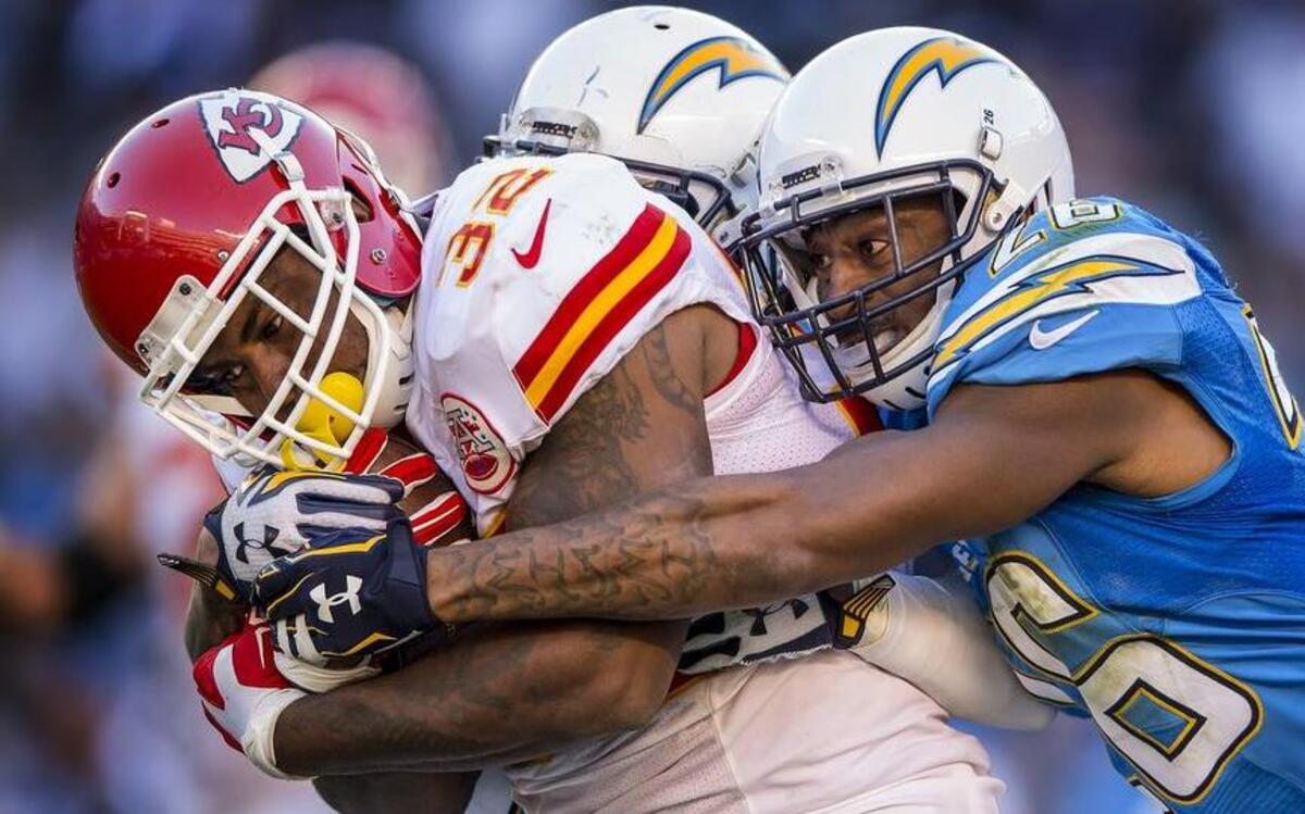 Chiefs running back Spencer Ware was tackled by Chargers cornerback Patrick Robinson after a 52-yard gain Sunday in San Diego. The Chiefs won, 33-3.