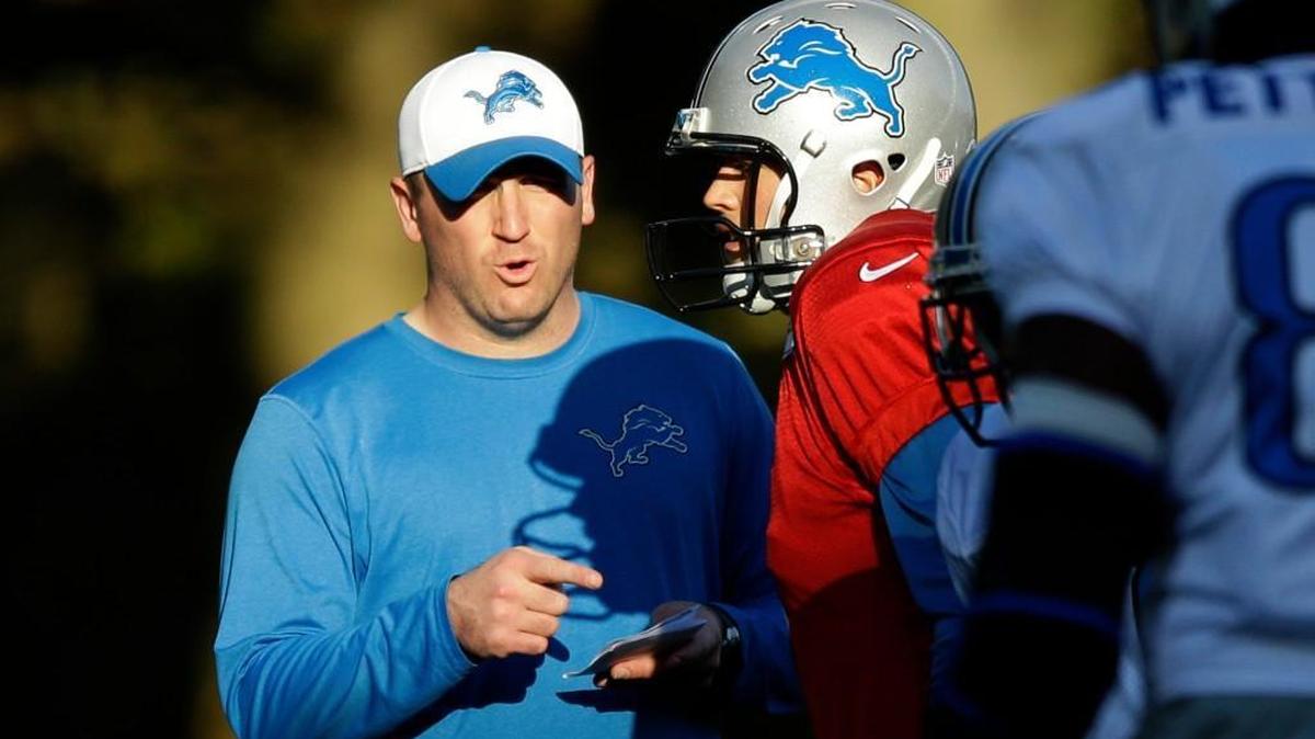 New Lions offensive coordinator Jim Bob Cooter worked with quarterback Matthew Stafford during a training session Wednesday in Chandler’s Cross, England.