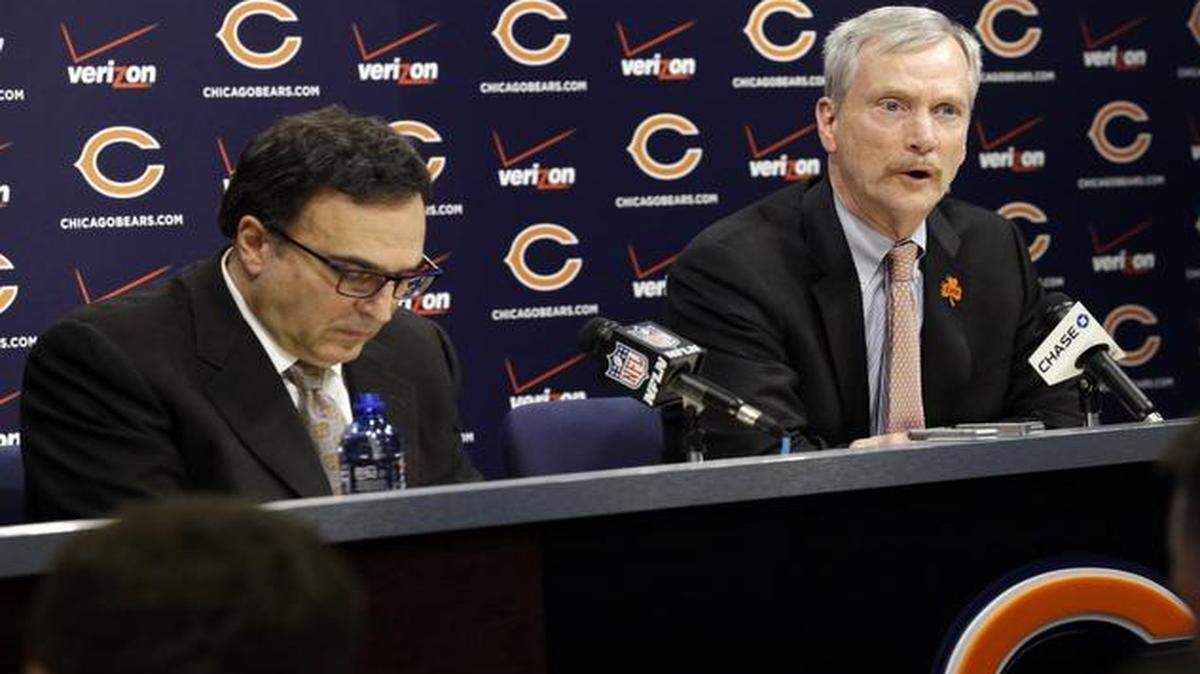 
Chicago Bears Chairman George H. McCaskey (left) spoke as President and CEO Ted Phillips looked down at a news conference at Halas Hall on Monday. Bears head coach Marc Trestman and general manager Phil Emery were fired Monday. 

