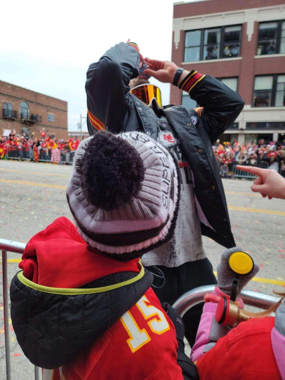 Kansas City Chiefs tight end Noah Gray tilts his head back while eating fruit snacks during the Super Bowl LVII parade on Feb. 15, 2023.