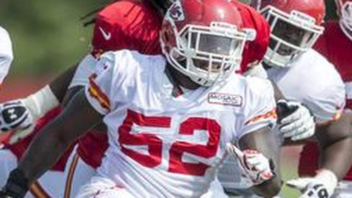 
Kansas City Chiefs linebacker James-Michael Johnson (52) pursued running back Knile Davis (34) on a running play on Thursday morning during Kansas City Chiefs training camp practice at Missouri Western State University in St. Joseph, Mo.
