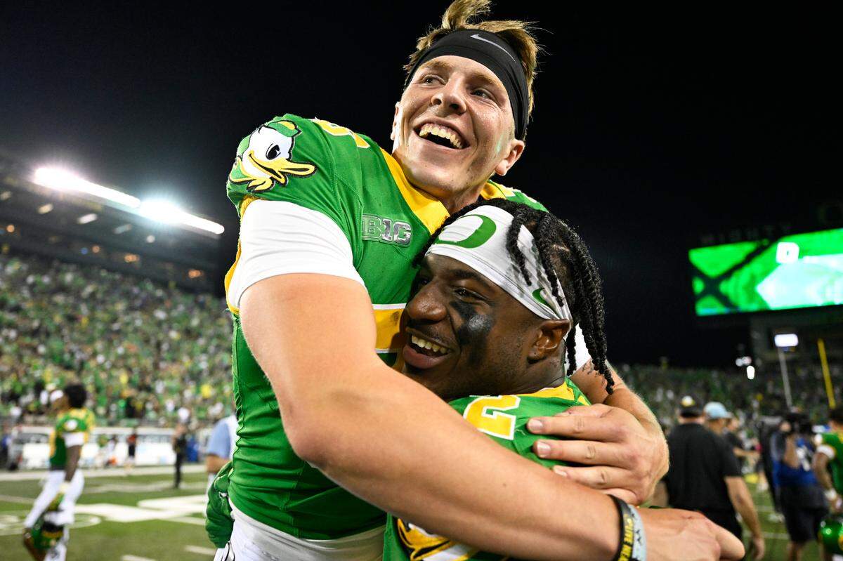 Oregon Ducks linebacker Jeffrey Bassa (2) carries place kicker Atticus Sappington (36) to the locker room in celebration after a game against the Boise State Broncos on Sept. 7, 2024 at Autzen Stadium in Eugene, Oregon.