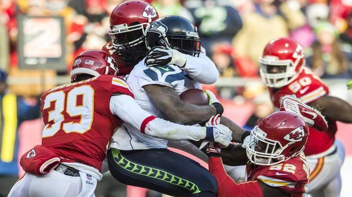 
Kansas City Chiefs free safety Husain Abdullah (39), with outside linebacker Tamba Hali and inside linebacker James-Michael Johnson (52) stuffed Seattle Seahawks running back Marshawn Lynch during a game in November.
