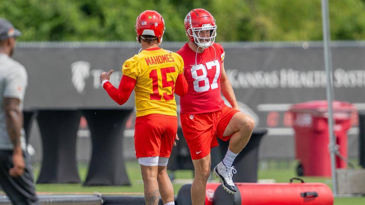 Kansas City Chiefs quarterback Patrick Mahomes (15) and tight end Travis Kelce (87) warm up during the first day of mandatory minicamp practice at the Chiefs training complex on Tuesday, June 11, 2024, in Kansas City.