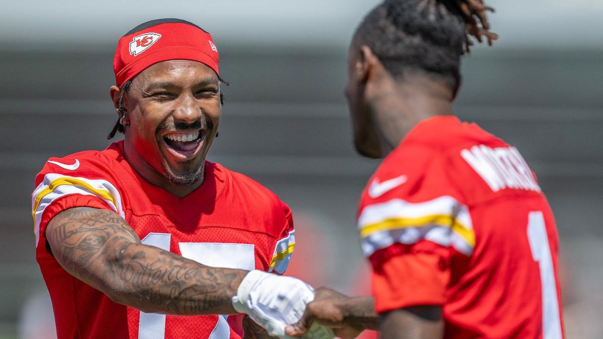 Kansas City Chiefs wide receiver Mecole Hardman, left, shakes hands with rookie Xavier Worthy during a minicamp practice in Kansas City last month.