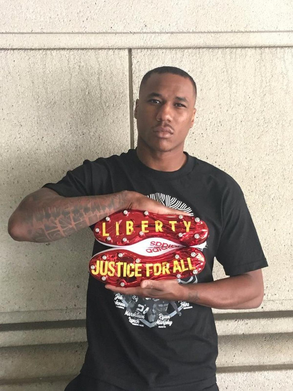 Peters shows off a special pair of cleats before the Chiefs’ season opener at New England.