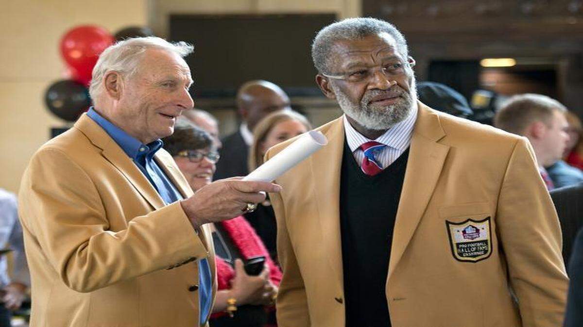 
Union Station officials and Hall of Fame players Jan Stenerud (left) and Bobby Bell announced Thursday that the traveling exhibit “Gridiron Glory: The Best of the Pro Football Hall of Fame” will be on display starting May 23.
