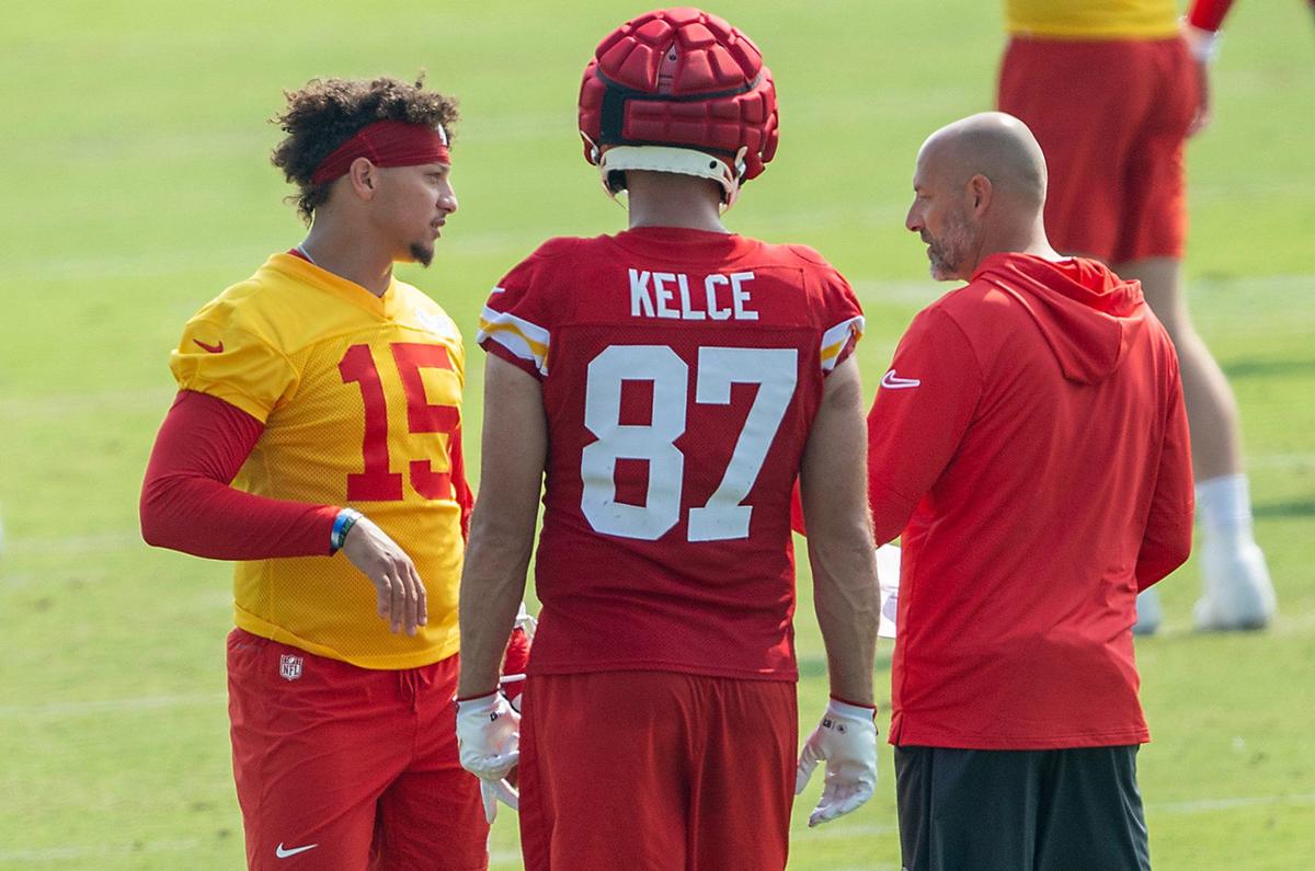 Chiefs quarterback Patrick Mahomes (15) and tight end Travis Kelce (87) talk with Chiefs offensive coordinator Matt Nagy during training camp at Missouri Western State University on Wednesday, July 24, 2024, in St. Joseph.