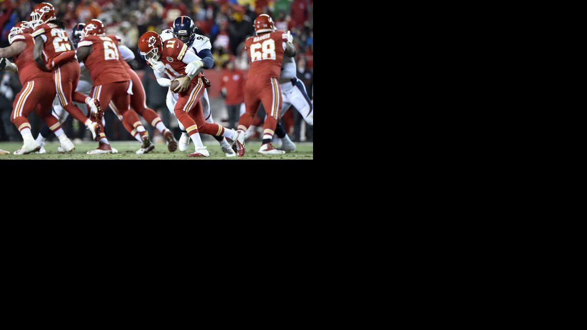 
Kansas City Chiefs quarterback Alex Smith (11) sacks Denver Broncos defensive end DeMarcus Ware (94) in the third quarter during the Kansas City Chiefs and Denver Broncos football game at Arrowhead Stadium on Sunday, November 30, 2014, in Kansas City, Mo..
