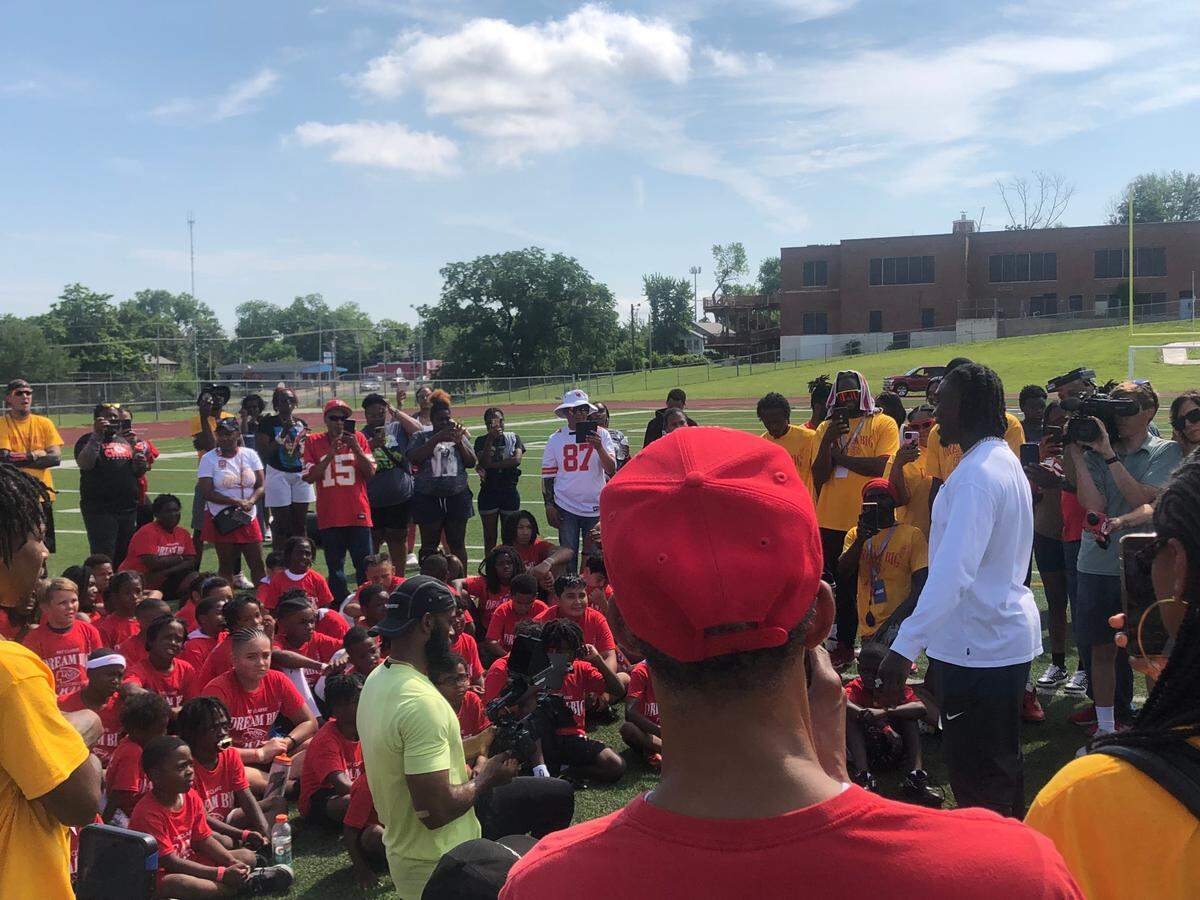 Kansas CIty Chiefs receiver Rashee Rice (white shirt) delivers a message to children at Pat Clarke’s “Dream Big” youth football camp on Saturday, June 8, 2024, at Central High School in Kansas City, Missouri.