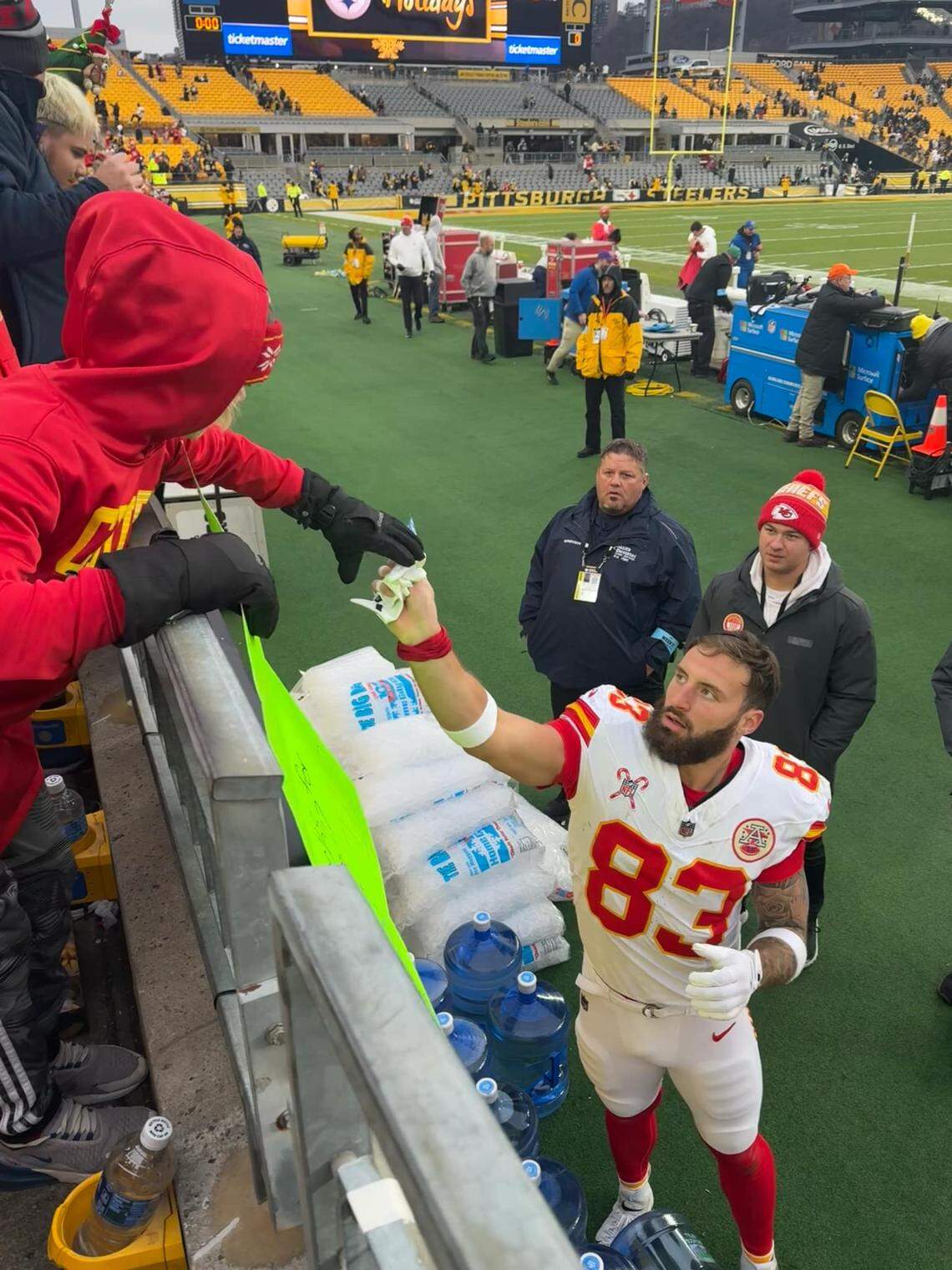 Kansas City Chiefs tight end Noah Gray gives 11-year-old Collin Larson his gloves after the Chiefs’ road victory at the Pittsburgh Steelers on Dec. 25, 2024.
