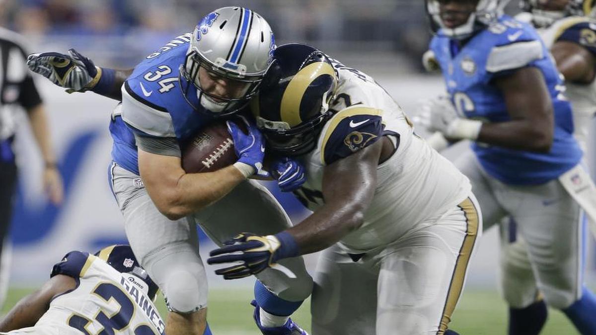The Chiefs on Friday signed former Los Angeles Rams defensive tackle Cam Thomas, shown tackling Detroit Lions fullback Zach Zenner on Oct. 16, 2016, in Detroit.