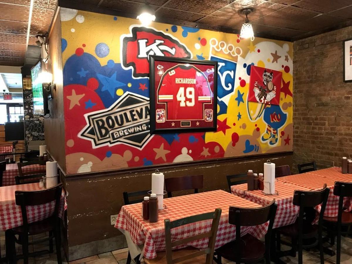 A framed jersey from frequent patron and former Chiefs running back Tony Richardson hangs on one wall in the restaurant.