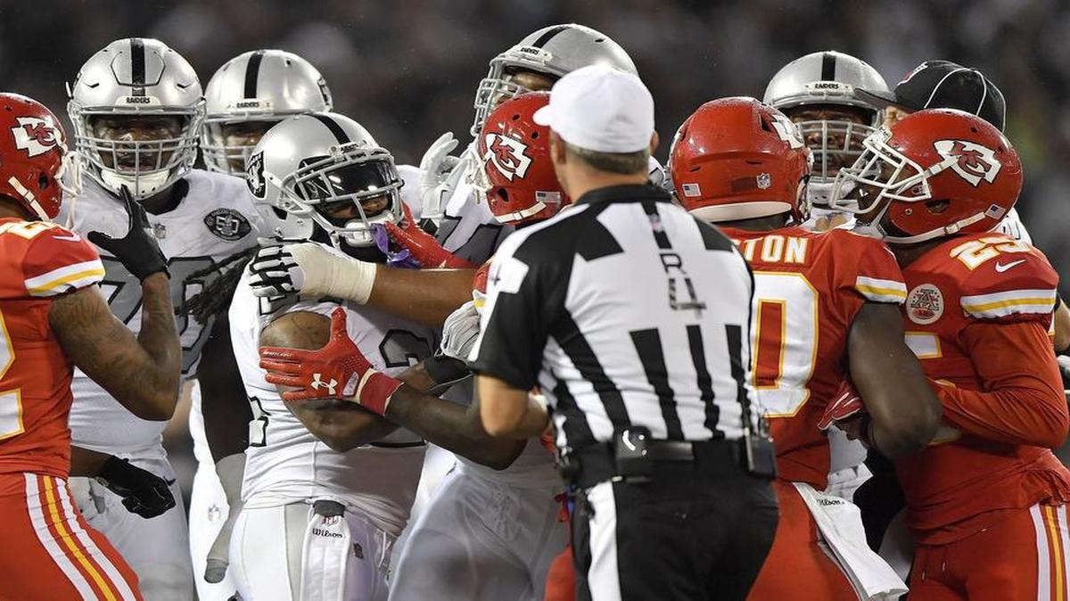 Oakland Raiders running back Marshawn Lynch (center) was penalized for shoving an official after Kansas City Chiefs cornerback Marcus Peters’ late hit on quarterback Derek Carr in the second quarter during Thursday’s game.