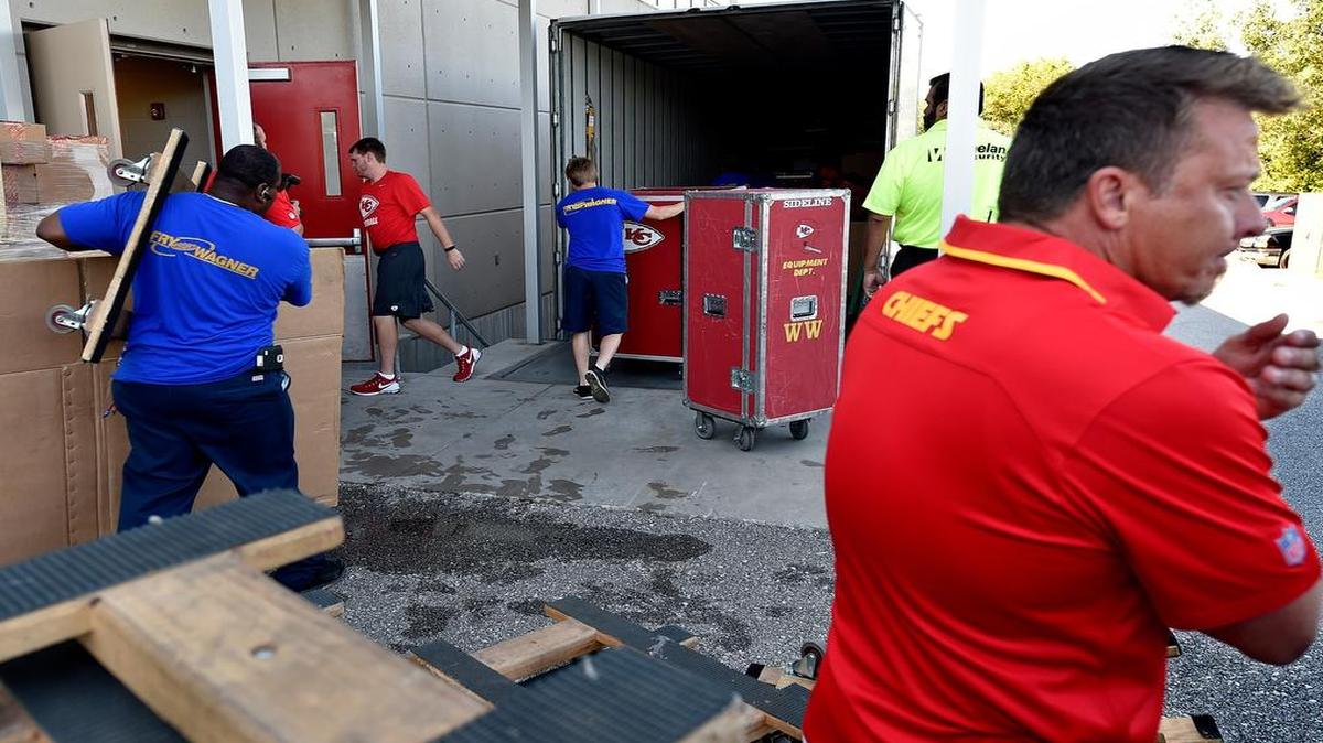 
Members of the Kansas City Chiefs equipment staff began packing Wednesday morning for the team’s trip to St. Joseph, Mo., for training camp which begins next week. Allen Wright (right) talked with the media while the trucks were being loaded. The team’s quarterbacks and rookies will report on July 28. Training camp will officially kick off for fans on Aug. 1 with a 3:30 p.m. practice and conclude with the club’s final practice on Aug. 19.
